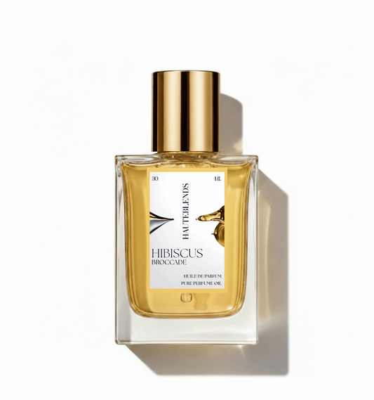 HauteBlends Hibiscus Brocade pure perfume oil concentrate inspired by Hibiscus Mahajád — 30ml Huile de Parfum fine fragrance in a rectangular clear glass bottle with a centered label and gold flat twist push dropper cap.