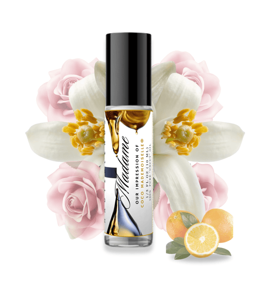 HauteBlends Madame pure perfume oil concentrate inspired by Coco Mademoiselle — 10ml travel-size clear glass rollerball bottle with a sleek black cap, styled against an artistic background of blooming roses, fresh jasmine, and orange citrus notes.