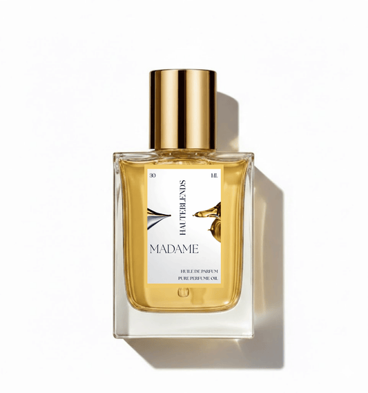 HauteBlends Madame pure perfume oil concentrate inspired by Coco Mademoiselle — 30ml Huile de Parfum fine fragrance in a rectangular clear glass bottle with a centered label and gold flat twist push dropper cap.
