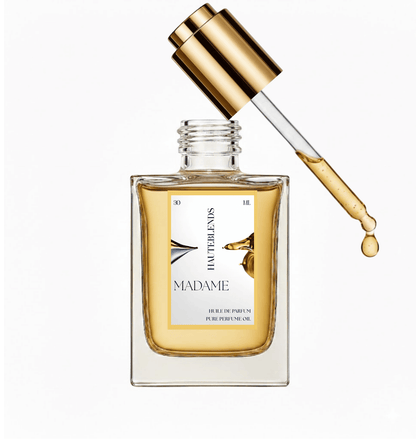 HauteBlends Madame pure perfume oil concentrate bottle open with a gold flat twist push dropper cap and internal glass pipette dispensing an alcohol-free, long-lasting fine fragrance drop inspired by Coco Mademoiselle.